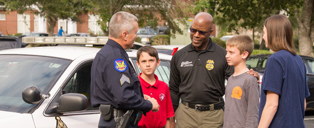 Police Officer teaching students